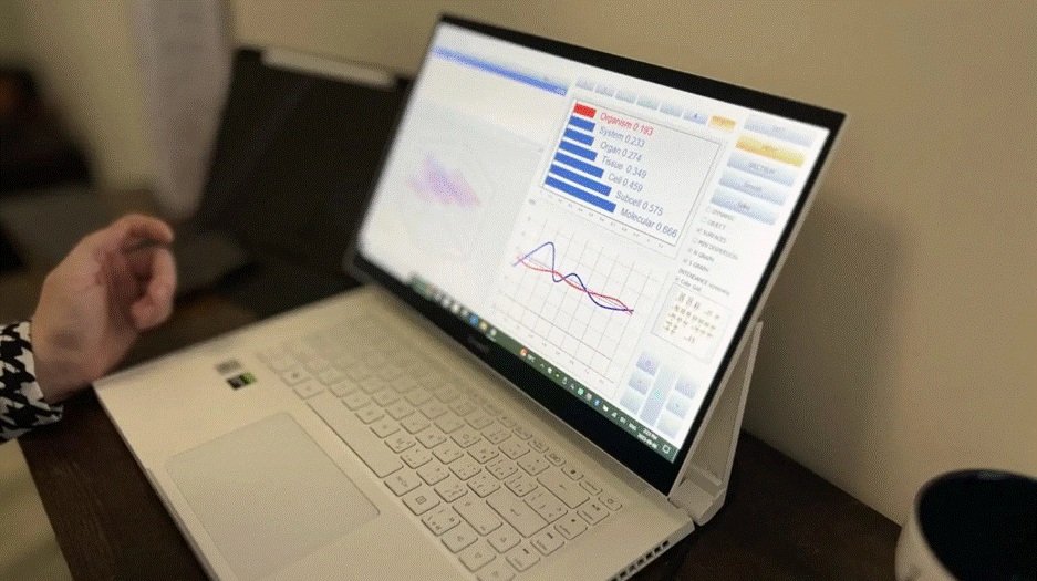 Bio-feedback scan results displayed on computer screen showing molecular and cellular analysis.